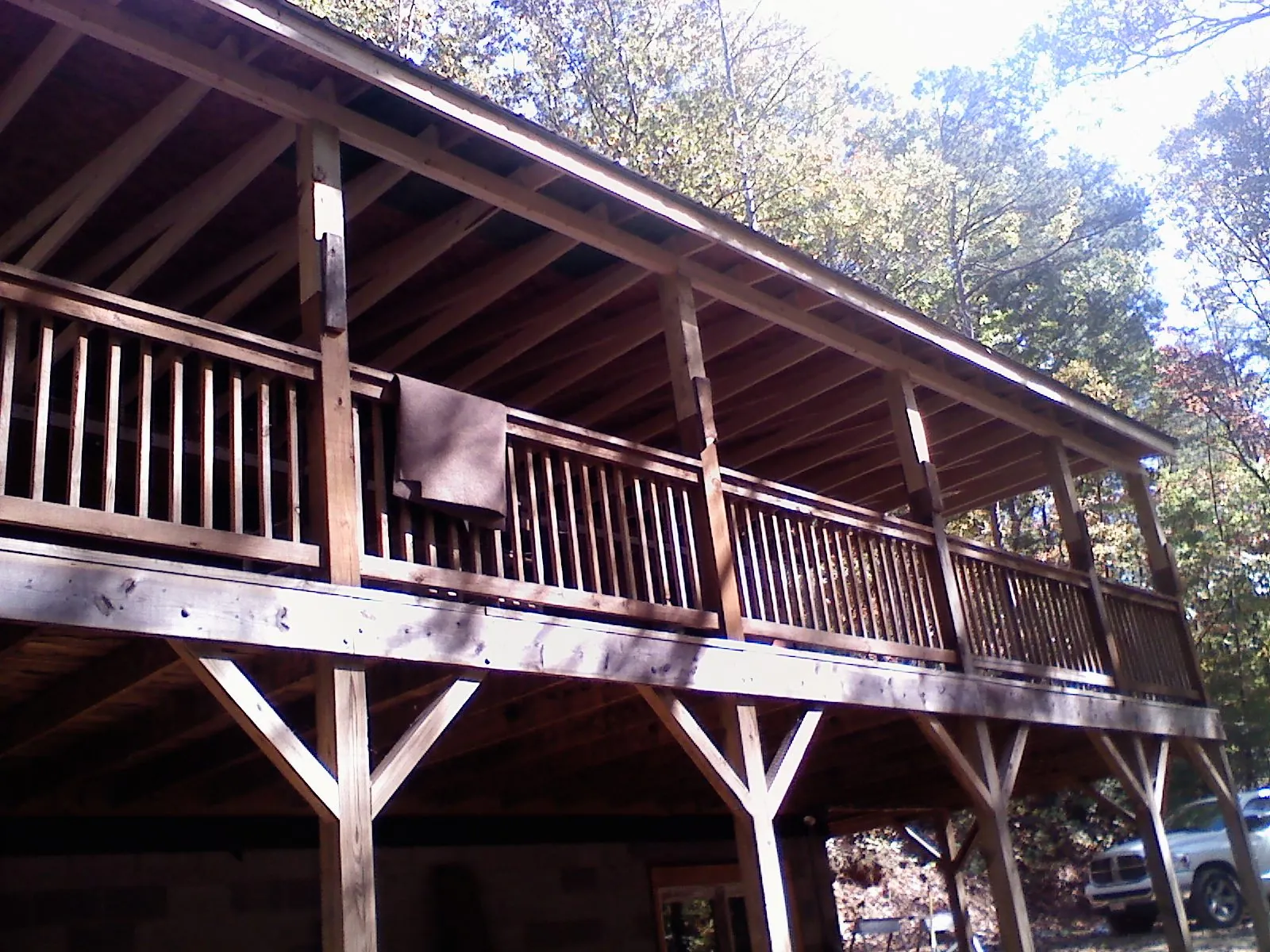 Timber framing under a new elevated porch and deck — Roof Leak Repair in Plattsburg by Roofing Brothers